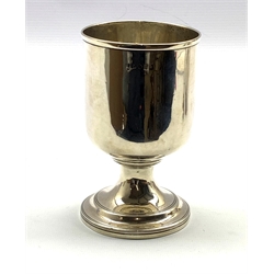 George III silver cup of plain cylindrical form on a pedestal foot H13cm, marks rubbed but London assay 6.5oz