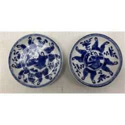Pair of Chinese blue and white Kangxi tea bowls and saucers decorated with seated and standing figures, two further plates painted with kneeling figures and miniature teapot of globular form with panelled exterior scenes together with small hexafoil vase of baluster form and cover (8)