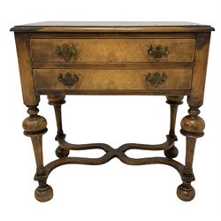 Queen Anne style walnut low boy, the rectangular top and moulded edge over two drawers, raised on turned supports, united by an X stretcher 