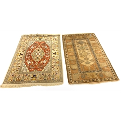 Persian design ground rug, lobed central medallion on red field decorated with stylised hunting scene, (143cm x 200cm) together with a Turkish prayer rug (123cm x 208cm) 
