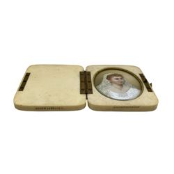 Early 20th century miniature oval head and shoulders portrait on ivory of a lady in her wedding dress in a folding ivory case by A Barrett & Sons, Piccadilly 7cm x 5.5cm