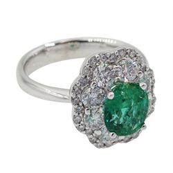 18ct white gold oval emerald and diamond cluster ring, hallmarked, emerald approx 1.20 carat