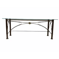 Wrought metal console table, the glass top over reeded cylindrical supports with bowed stretchers 