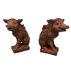 Pair of terracotta finish composite stone garden figures in the form of wild boars 