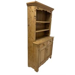 Victorian pine dresser, the fixed cornice over two fixed shelves to base with two drawers and two cupboards, raised on stile supports W110cm, H205cm, D45cm
