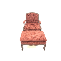 French style figured walnut open armchair, with swept arms and serpentine terminals, upholstered in floral claret red damask with squab cushion, incised fish scale carving to the show frame, (W76cm)  together with a matching footstool, (W76cm