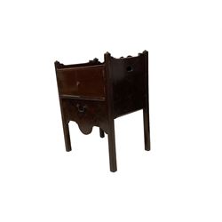 George III mahogany tray top night-cabinet commode, the three quarter gallery with pierced handle back, the rectangular sliding top over two front cupboard doors, opening to reveal hinged lid enclosing the washbasin and bowl rest