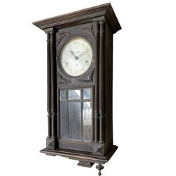 French - Westminster chiming 8-day three train wall clock in a stained oak case.c1920.