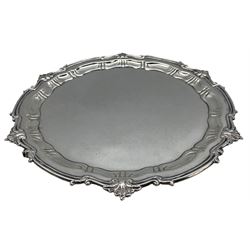 George V silver salver, with shell capped edge and raised on three pad feet, hallmarked Jay, Richard Attenborough Co Ltd, Sheffield 1923