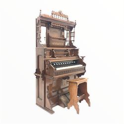 Late 19th / Early 20th century walnut cased and mirrored back American organ, reading 'Arthur C Smith, 47 Carr Lane, Hull' (W127cm) together with a sloped music stool 