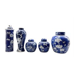 Group of 19th century Chinese prunus pattern ceramics including three ginger jars, cylindrical vase and cover and an inverted baluster form vase H28cm (5)