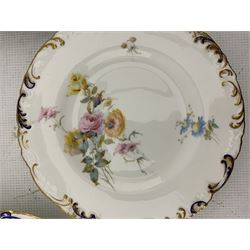Set of four late Victorian Royal Crown Derby plates each painted with Spring flowers within a moulded blue and gilt border, three with the retailer's mark of Phillip's, London D22cm 1897/8 (4)