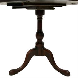 Georgian mahogany side table, the oval drop-leaf top on turned pedestal, three splayed supports with pointed pad feet