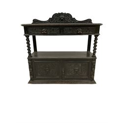 Late Victorian dark oak buffet, the scrolled mask carved raised back over two drawers raised on spiral turned uprights, two panelled cupboards under with similar carving, raised on stile supports W120cm