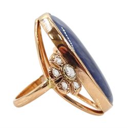 Gold sapphire and diamond ring, the central oval cabochon sapphire with a cluster of round brilliant cut diamonds set either side by Judith Crowe, hallmarked 9ct, sapphire approx 44.30 carat, total diamond weight approx 0.60 carat