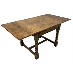 Mid-20th century oak draw-leaf dining table, the frieze rails with incised decoration, on turned supports joined by H-shaped stretchers 