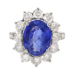 18ct white gold oval sapphire and round brilliant cut diamond cluster ring, with diamond set shoulders, stamped 18K, sapphire 4.77 carat, total diamond weight 2.04 carat, with World Gemological Institute report