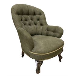 Victorian tub chair in buttoned back green fabric, raised on cabriole supports, terminating in plastic castors 