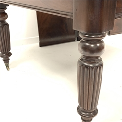 Large late 20th century Victorian style dining table, the moulded rounded rectangular top on pull out action base, turned and reeded supports on castors, three additional leaves, H72cm, 125cm x 150cm - 311cm, 10' 2'' (fully extended)