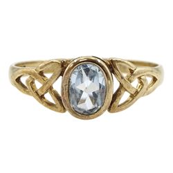 9ct gold oval blue topaz ring, with pierced Celtic knot design shoulders, hallmarked 