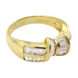 18ct gold tapered baguette cut diamond bow ring, with two row baguette cut diamond shoulders