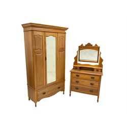 Edwardian two piece satin walnut bedroom suite, comprising of wardrobe, the projecting cornice over one central mirror door with interior fitted for hanging, over one long drawer, together with mirror back dresser, with two small and three long drawers, raised on turned feet, terminating in castors 