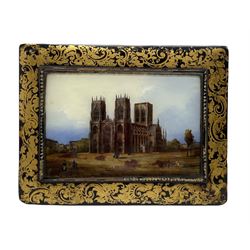 Victorian papier-mache blotter the cover gilt-heightened and inset with a reverse painted glass panel of York Minster 30cm x 23cm 