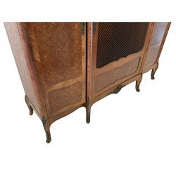 Mid-to late 20th century French Kingwood armoire cabinet, break-front with moulded top, decorated with parquetry work, the central door with grille over shaped panel, two flanking doors, with trailing foliage and cartouche cast metal mounts, shaped apron with shell mount, on cabriole feet mounted by trailing foliage castings with scrolled terminals
