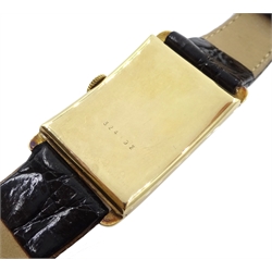 International Watch Co Schaffhausen 14ct gold 'curvex' wristwatch, c.1929, silvered dial, the hinged back case numbered 324192, on leather strap