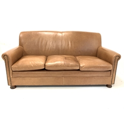 Traditional brown studded leather upholstered three seat sofa, with squab cushions, raised on turned front supports 