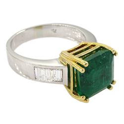 18ct white and yellow gold single stone emerald ring, with channel set baguette diamond shoulders, stamped 750, emerald 4.83 carat, total diamond weight 0.60 carat