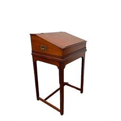 Mahogany school writing slope, the lifting top opening to reveal space with four small drawers, raised on base with square supports W62cm, H103cm, D52cm 