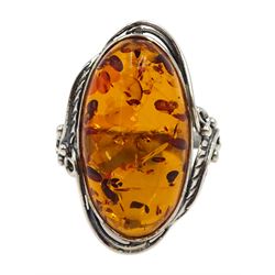 Silver oval Baltic amber ring, with leaf design gallery, stamped 925 