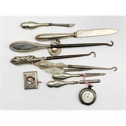 Modern silver vesta case inset with an enamel panel, fob watch in silver case, silver fob, manicure implements etc