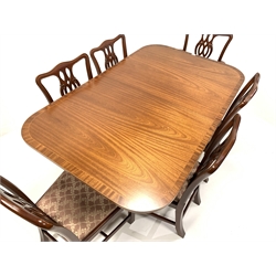 Georgian style mahogany twin pedestal dining table, with cross banded top, (100cm x 160cm, H75cm) and eight (6+2) Chippendale style chairs, pierced splats, drop in upholstered sea pads, raised on square moulded supports, (W52cm)
