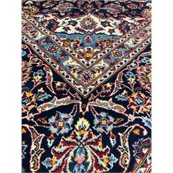 Persian Kashan red ground rug, the lobed medallion on busy red field, enclosed by border 273cm x 395cm