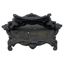Victorian cast iron boot scraper, in the form of a large cartouche with scrolling acanthus leaf feet, H16cm