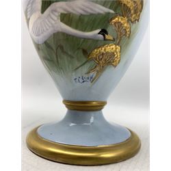 20th century twin handled vase by F. Clark, of ovoid form, hand painted with three swans in flight after Charles Baldwyn, signed by F. Clark a former Worcester artist, H24.5cm 