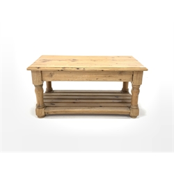 20th century pine coffee table, moulded top raised on turned and block supports united by a slatted under tier