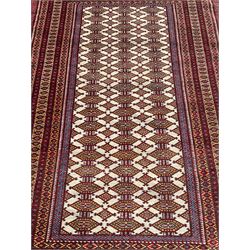 Pair Persian Bokhara rugs, ivory ground field decorated with three rows of Gul motifs, surrounded by multiple borders with overall geometric design
