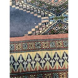 Kilim pattern rug with a centre lozenge design on beige field with multi stripe  border, together with rug of similar design on blue field 