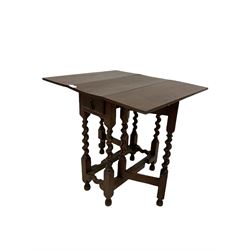 19th century elm gate leg table, the drop leaf top and one frieze drawer, over gate leg action, raised on spiral turned square supports 