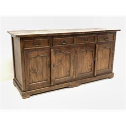 Rustic solid oak sideboard, fitted with four drawers and two double cupboards each enclosing a fixed shelf, 181cm x 60cm, H90cm