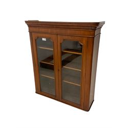 Victorian walnut bookcase, moulded cornice over two glazed doors, fitted with three adjustable shelves 