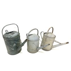 Three vintage galvanised metal watering cans, together with three garden shears, two sieves and three oil lamps 