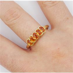9ct gold five stone oval orange sapphire ring, hallmarked 