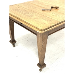 Early 20th century oak dining table, rounded rectangular telescopic extending top with two additional leaves,  fitted with 'Joseph Fitton' winding mechanism, H74cm, 101cm x 113cm - 164cm (extended)