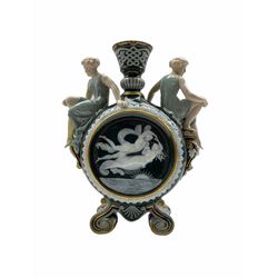 A Victorian George Jones Pate-sur-Pate moon flask decorated by Frederick Schenk, a maiden seated to the shoulder of each, impressed and numbered beneath 5648.. H36cm 