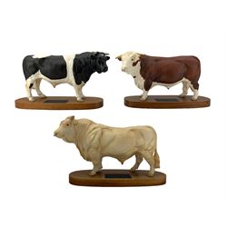 Three Beswick bulls from the Connoisseur series, Charolais No.A2463A, Friesian No. A2580 and Hereford No. A2542A, all on wooden plinths (3)