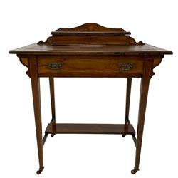 Late Victorian rosewood writing desk, the rectangular moulded top with leather inset surmounted by hinged compartment with pen rest and document divisions, inlaid with fan motifs and urn with extending scroll foliate, fitted with single frieze drawer, on square tapering supports joined by rectangular under tier, brass and ceramic castors, box wood stringing throughout 
